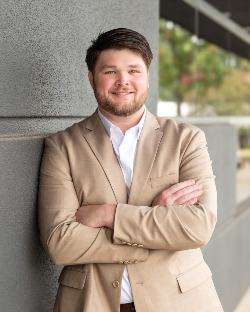 Professional headshot of REALTOR® Cody Smith with The JK Group at Berkshire Hathaway HomeServices C. Dan Joyner, REALTORS® Midtown office.